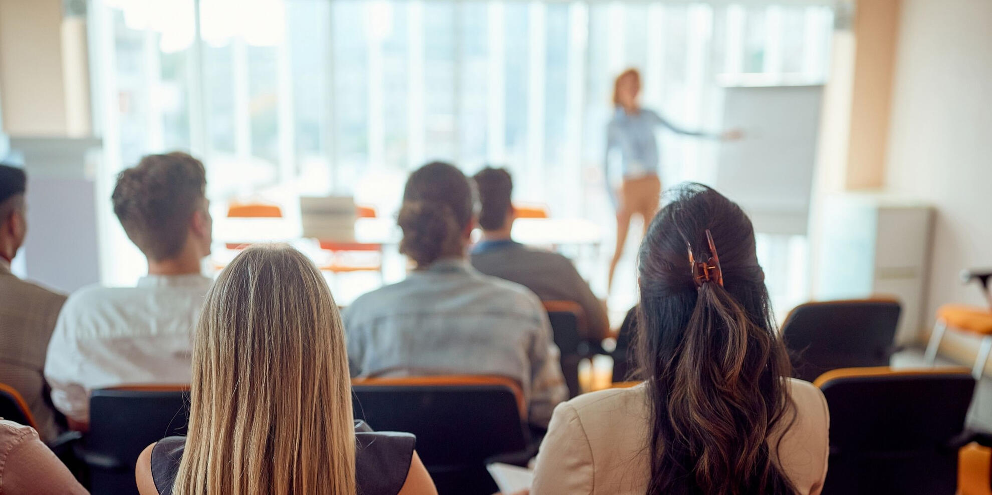 A trainer training a group of sales leaders